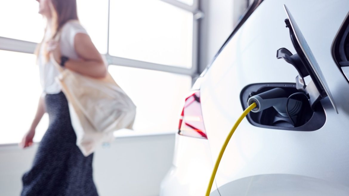 Woman leaving her salary sacrifice car charging