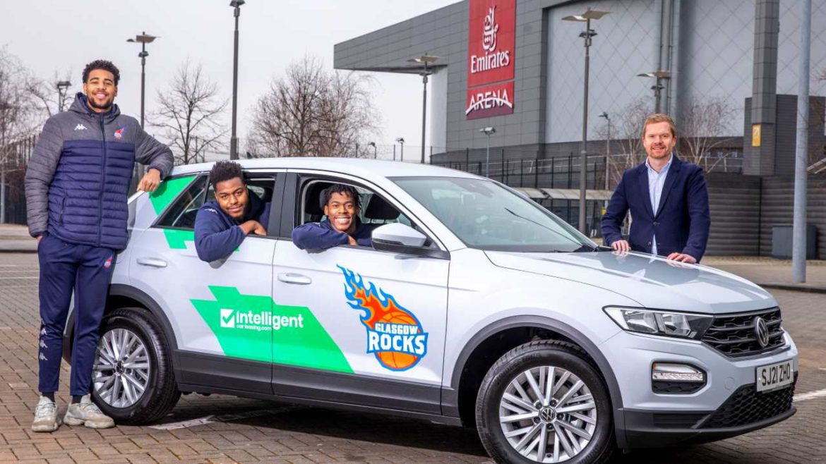 Martin Brown presents the Intelligent Car Leasing car to Glasgow Rocks basketball trio