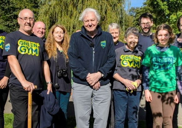 Sir David Attenborough and volunteers