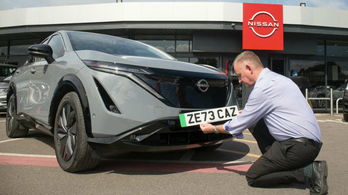 New number plate being fitted to Nissan Ariya electric car